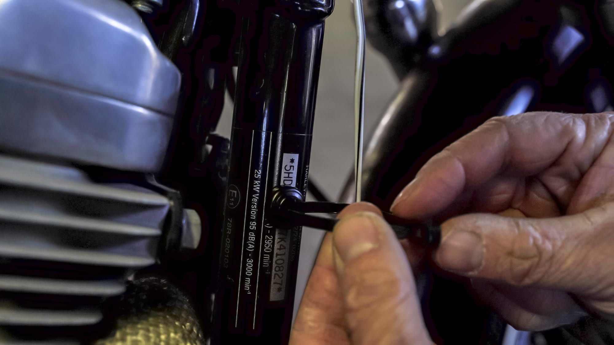 Wiring zip-tied to a magnetic mount on a motorcycle frame