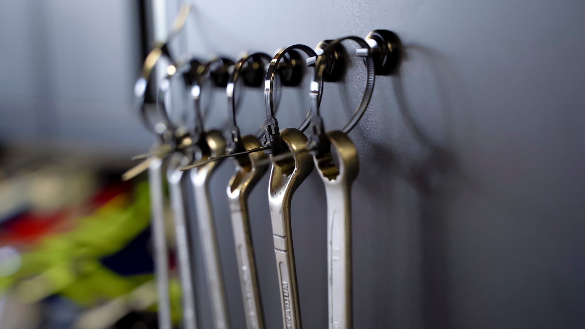 Wrenches hanging from Hatsbi magnetic mounts on a steel cabinet